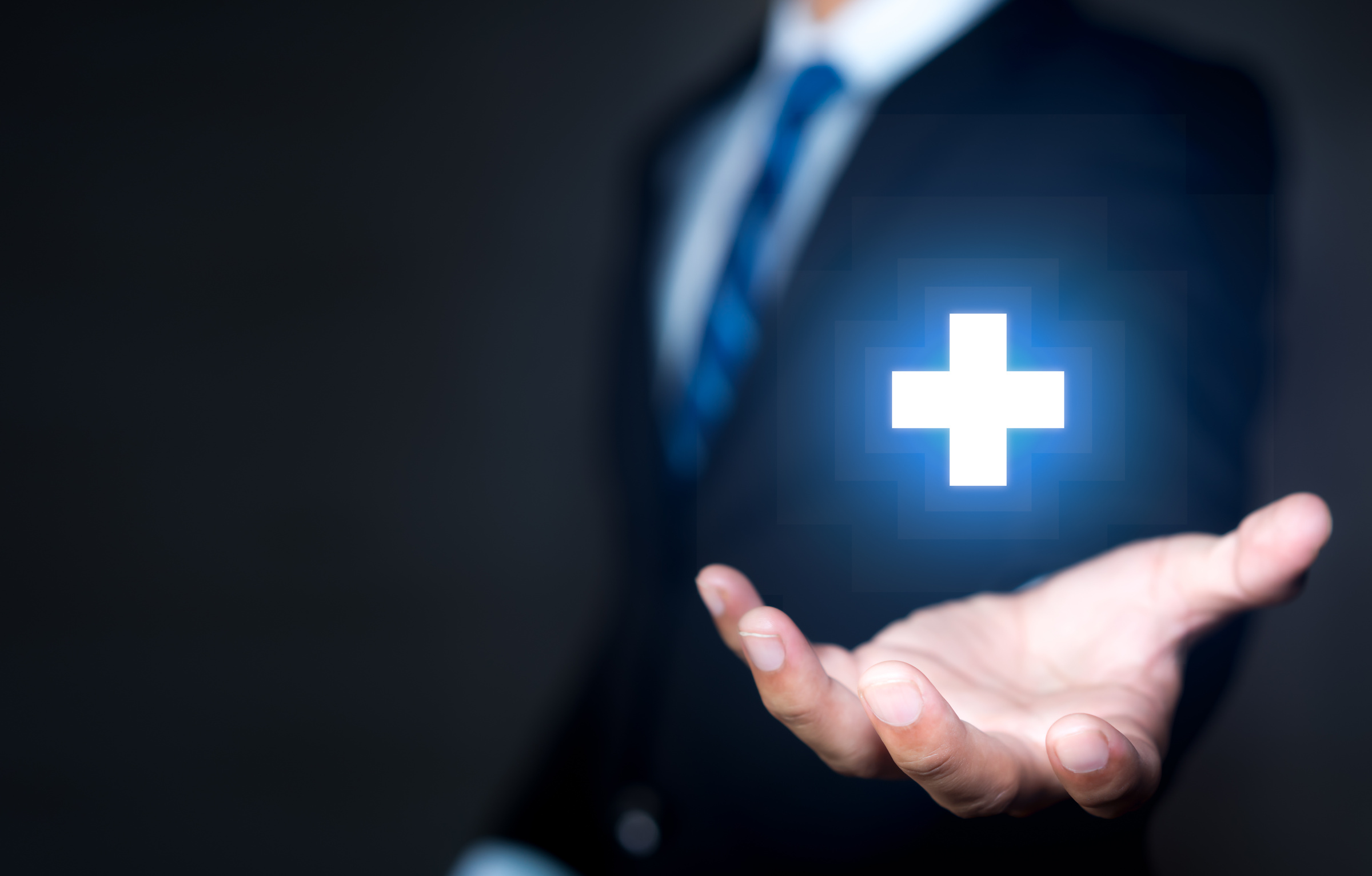 Businessperson with a Positive Icon on Black Background